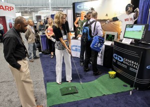 Jennifer demonstrates her golfing talents in our booth