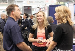 Tracy and Jennifer talk shop with a visitor to our booth
