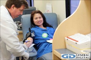 Pam relaxes while donating blood